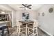 Dining area featuring wood-look floors, ceiling fan, a table with four chairs and a small painting at 2112 Palmyra Dr, Marietta, GA 30067