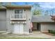 Charming condo building with a balcony, American flag, and well-maintained landscaping at 2112 Palmyra Dr, Marietta, GA 30067
