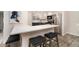 Bright kitchen featuring white cabinets, granite countertops, stainless steel appliances and breakfast bar at 2112 Palmyra Dr, Marietta, GA 30067