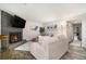 Bright living room features a brick fireplace, TV, wood-look flooring and neutral decor at 2112 Palmyra Dr, Marietta, GA 30067