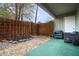 Private outdoor patio with seating area, greenery, and a wooden fence for privacy at 2112 Palmyra Dr, Marietta, GA 30067