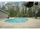 Community pool with surrounding trees and ample deck space for relaxation and enjoyment at 2112 Palmyra Dr, Marietta, GA 30067