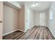 Basement featuring wood grain flooring, neutral walls and trim and multiple doors at 2184 Pemberton Sw Rd, Atlanta, GA 30331
