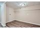 Unfinished basement featuring vinyl floors, shelving, and laundry hookups, ready for customization at 2184 Pemberton Sw Rd, Atlanta, GA 30331