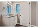 Bathroom featuring granite countertops, a vanity, and a window at 2184 Pemberton Sw Rd, Atlanta, GA 30331