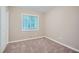 Bedroom with carpeting, neutral walls, and natural light at 2184 Pemberton Sw Rd, Atlanta, GA 30331