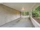 Covered carport with brick accents and recessed lighting offers convenient parking and protection from the elements at 2184 Pemberton Sw Rd, Atlanta, GA 30331