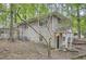 Exterior view of a two-story brick home with mature trees and landscaping at 2184 Pemberton Sw Rd, Atlanta, GA 30331