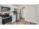 Modern kitchen with stainless steel appliances and white cabinets at 2184 Pemberton Sw Rd, Atlanta, GA 30331