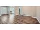 View of the living room and entrance to the kitchen with stainless steel appliances at 2184 Pemberton Sw Rd, Atlanta, GA 30331