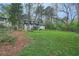 Fenced backyard with a canopy of trees and wooded views at 2772 Dunnington Cir, Atlanta, GA 30341