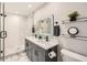Modern bathroom boasts double vanity, frameless glass shower, and stylish décor at 2772 Dunnington Cir, Atlanta, GA 30341