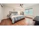 Bedroom with hardwood floors, ceiling fan, and lots of natural light at 2772 Dunnington Cir, Atlanta, GA 30341