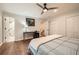 Spacious bedroom features hardwood floors, ceiling fan, and en suite bathroom at 2772 Dunnington Cir, Atlanta, GA 30341