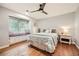 Bedroom features a window seat, hardwood floors, and a ceiling fan at 2772 Dunnington Cir, Atlanta, GA 30341