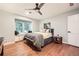 Bedroom boasts wood floors, large windows, window seat, and modern decor at 2772 Dunnington Cir, Atlanta, GA 30341