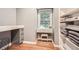 Walk-in closet has a built in desk and ample shelving for storage at 2772 Dunnington Cir, Atlanta, GA 30341