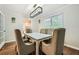Inviting dining room with a modern chandelier, seating for six, and lots of light at 2772 Dunnington Cir, Atlanta, GA 30341