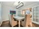 Elegant dining room with a modern chandelier and seating for six at 2772 Dunnington Cir, Atlanta, GA 30341