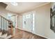 Inviting foyer with hardwood floors and a white front door framed by sidelights at 2772 Dunnington Cir, Atlanta, GA 30341