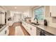 Bright kitchen with white cabinets, granite countertops, and hardwood floors at 2772 Dunnington Cir, Atlanta, GA 30341