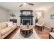 This is a well decorated living room with a fireplace and lots of natural light at 2772 Dunnington Cir, Atlanta, GA 30341