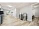Open living space boasts tile ceiling, wood-look floors, breakfast bar and access to the bedroom at 2772 Dunnington Cir, Atlanta, GA 30341