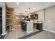 Finished basement featuring a bar area with counter seating, sink and mini-fridge and unique design elements at 6060 Masters Club Dr, Suwanee, GA 30024