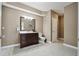 Neutral bathroom featuring a large vanity, toilet and tile floors at 6060 Masters Club Dr, Suwanee, GA 30024
