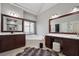 Bright bathroom with double vanity, soaking tub, and large mirrors at 6060 Masters Club Dr, Suwanee, GA 30024