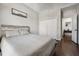 Bedroom with hardwood floors, neutral walls, and an ensuite leading to an adjoining room at 6060 Masters Club Dr, Suwanee, GA 30024