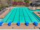 A community offers a long pool with starting blocks with seating alongside it at 6060 Masters Club Dr, Suwanee, GA 30024