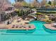 A community pool features a slide with tables and seating options for residents at 6060 Masters Club Dr, Suwanee, GA 30024