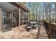 Exterior deck with furniture overlooks the backyard and surrounding trees, accessible from the house at 6060 Masters Club Dr, Suwanee, GA 30024