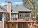 Aerial view of back porch and second-story deck, perfect for outdoor entertaining or relaxation at 6060 Masters Club Dr, Suwanee, GA 30024
