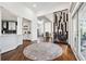 Hallway view towards kitchen and dining area, featuring hardwood floors and lots of natural light at 6060 Masters Club Dr, Suwanee, GA 30024