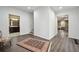 Hallway connecting to a bathroom and sitting area, with wood-look floors at 6060 Masters Club Dr, Suwanee, GA 30024