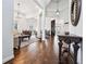 Spacious living room with hardwood floors, large windows, and elegant decor at 6060 Masters Club Dr, Suwanee, GA 30024