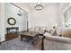 Open living room with hardwood floors, elegant furniture, and lots of natural light at 6060 Masters Club Dr, Suwanee, GA 30024