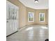 Bright room with tile floors and two large windows at 6060 Masters Club Dr, Suwanee, GA 30024