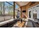 This screened porch offers comfortable seating arrangements, a ceiling fan, and a relaxing space at 6060 Masters Club Dr, Suwanee, GA 30024