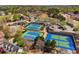Aerial view of tennis courts with an adjacent pool and clubhouse enhances the community's appeal at 6060 Masters Club Dr, Suwanee, GA 30024