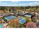 The community has multiple green and blue tennis courts with a gazebo-covered seating area at 6060 Masters Club Dr, Suwanee, GA 30024
