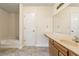 Bathroom featuring a bath tub and vanity sink with a large mirror, plus a white door at 9992 Neuchatel Cres, Jonesboro, GA 30238