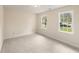 Comfortable bedroom featuring neutral carpet and two windows that provide natural light at 9992 Neuchatel Cres, Jonesboro, GA 30238
