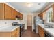 Functional kitchen with stainless steel appliances, wood cabinets, and tile flooring at 9992 Neuchatel Cres, Jonesboro, GA 30238