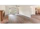 Bright living room with hardwood floors, a brick fireplace, and abundant natural light at 9992 Neuchatel Cres, Jonesboro, GA 30238
