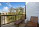 Relaxing outdoor balcony with seating and a view of the surrounding greenery and buildings at 1105 Rivard Nw Cir, Atlanta, GA 30318