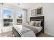 Comfortable bedroom with two windows for natural light, a dark wood bed frame, and stylish decor at 1105 Rivard Nw Cir, Atlanta, GA 30318