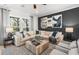 Inviting living room boasts a large sectional sofa, stylish decor, and an open layout with plenty of natural light at 1105 Rivard Nw Cir, Atlanta, GA 30318